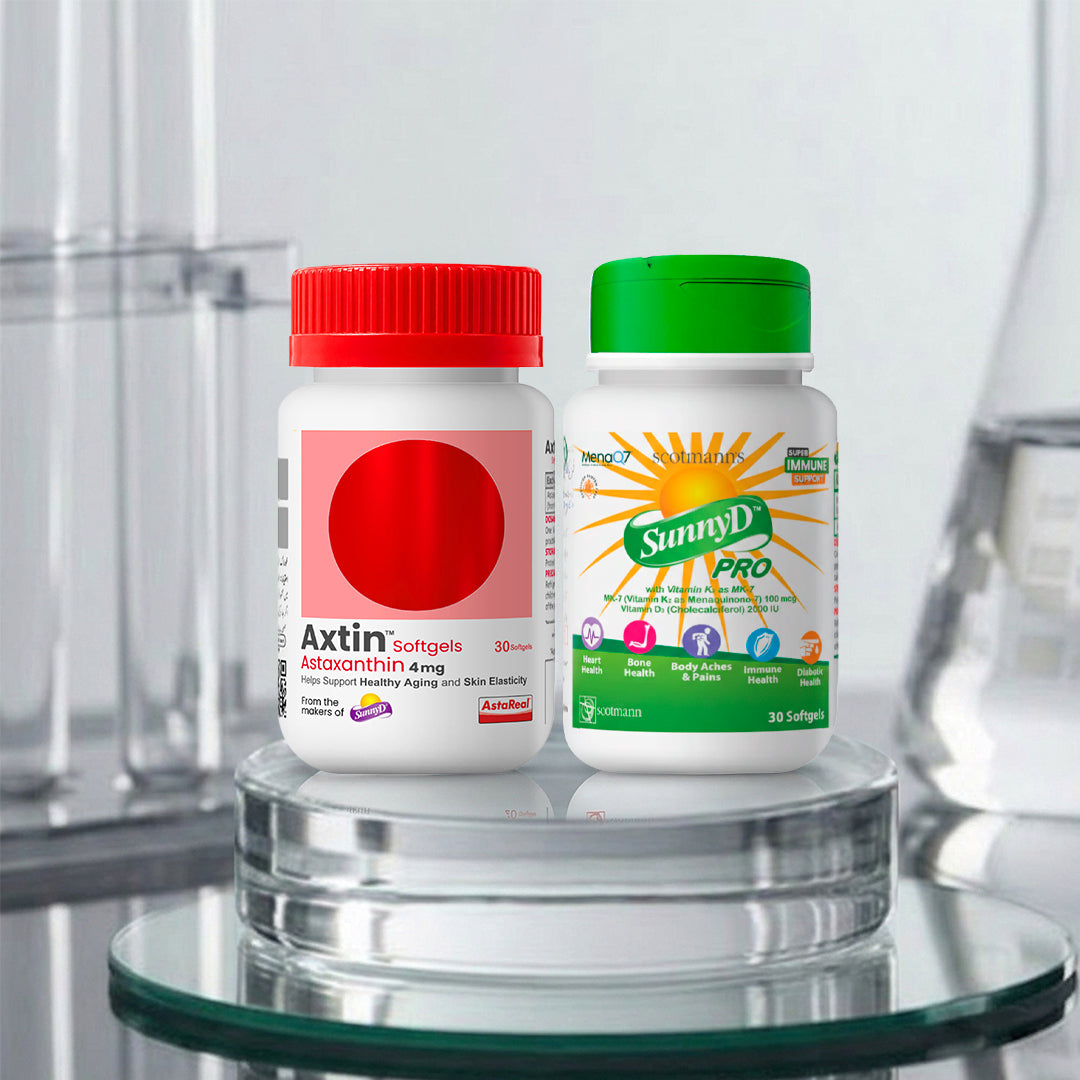 Two supplement bottles displayed on a glass pedestal: a white bottle with a red cap labeled Axtin Softgels, and a white bottle with a green cap labeled SunnyD PRO.