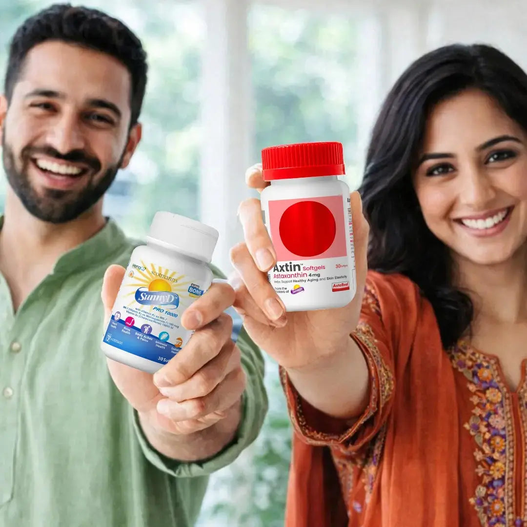 A smiling man in a green shirt and a smiling woman in an orange embroidered top hold up two supplement bottles toward the camera in a bright indoor setting. One bottle is labeled Sunferon and the other is labeled Axtin Sunfern.
