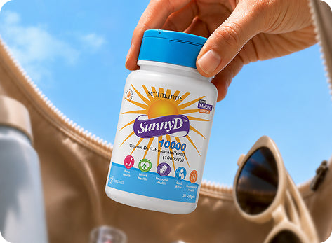 Adult taking a vitamin D 10000 IU softgel with a meal to support absorption